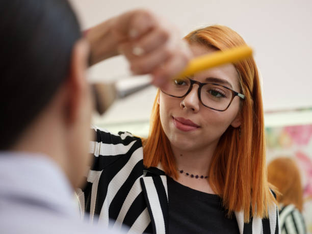 Latin woman, young adult, make-up artist, client, professional occupation